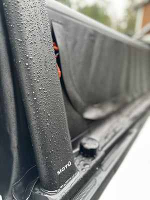 MOTU hybrid truck cap with waterproof softopper canopy and exoskeleton gear carrying rack. 